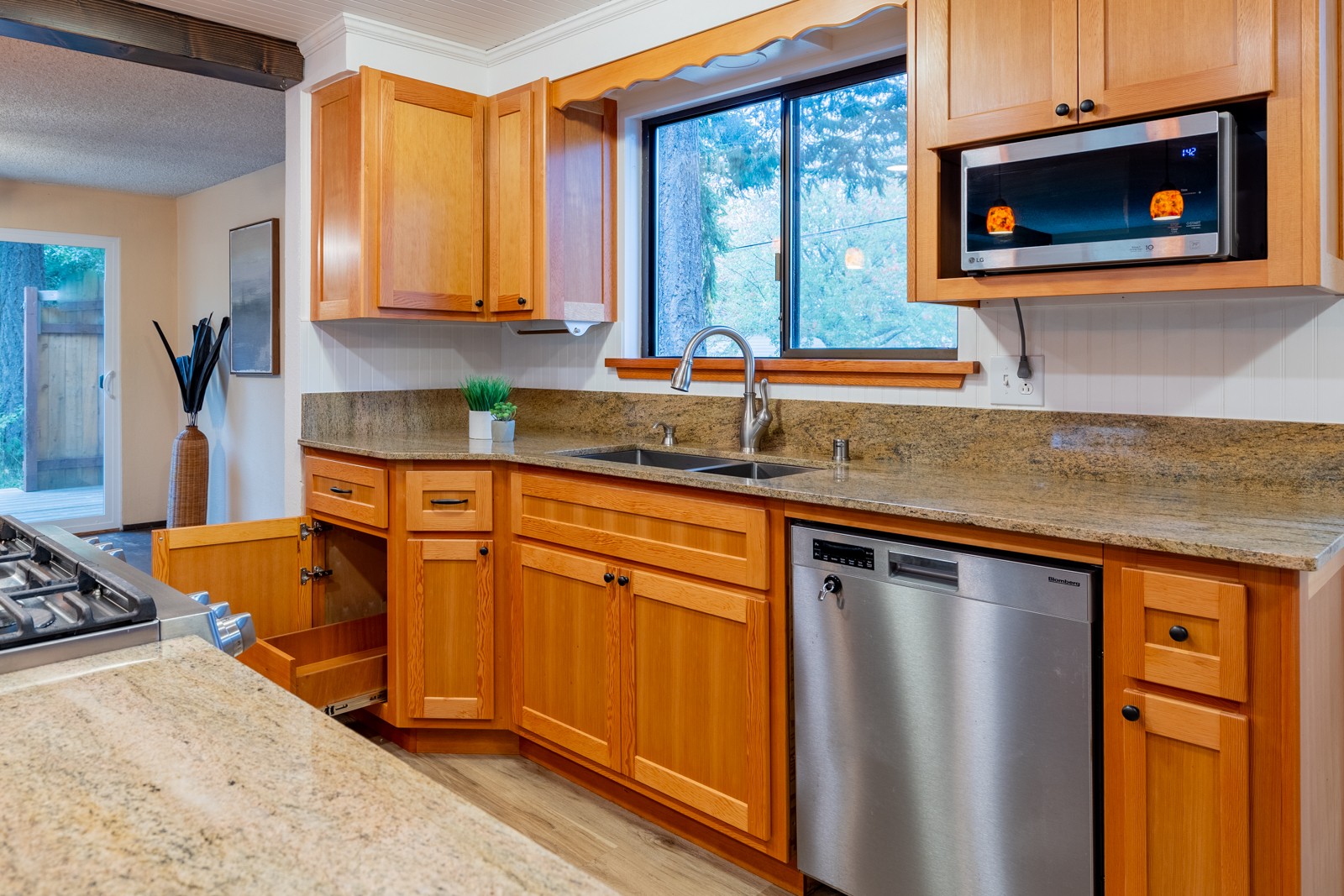 Custom kitchen sink cabinets with granite countertops
